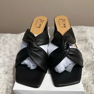 French Sole Black Napa Leather Mules with Twisted Design